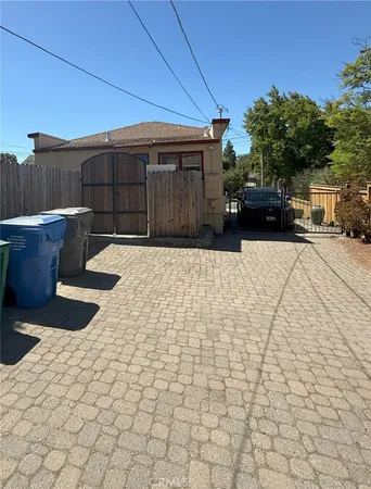 a view of a backyard with sitting area