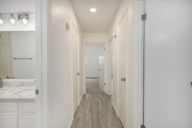 a view of a bathroom from the hallway