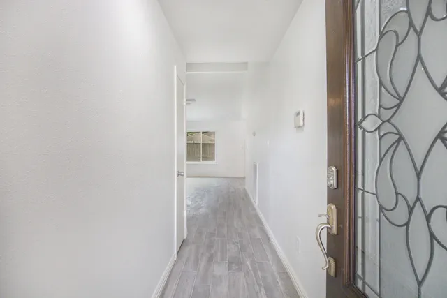 a view of entryway with wooden floor