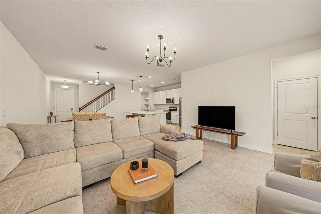 10210 Newel Valley Loop Riverview, FL 33569 - Photo 10 of 30 a living room with furniture and a flat screen tv