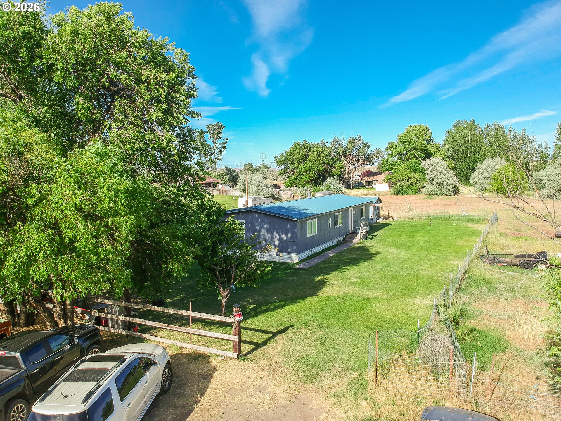 80649 Crooked Road Irrigon, OR 97844 - Photo 17 of 21 a view of backyard with swimming pool and trees in the background