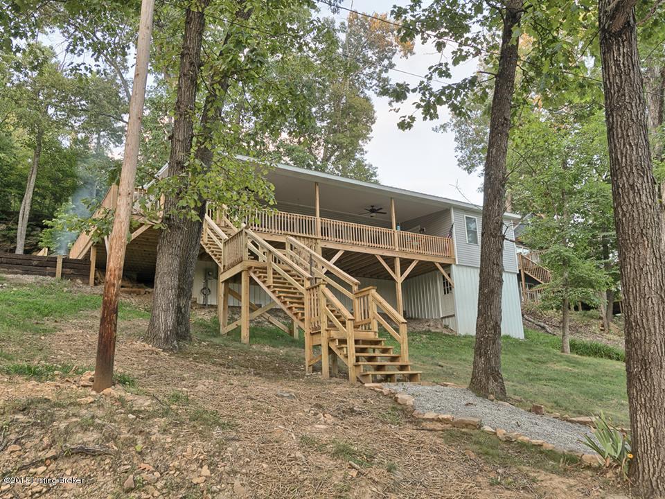 HUGE covered porch on the front let's the lake shine IN!