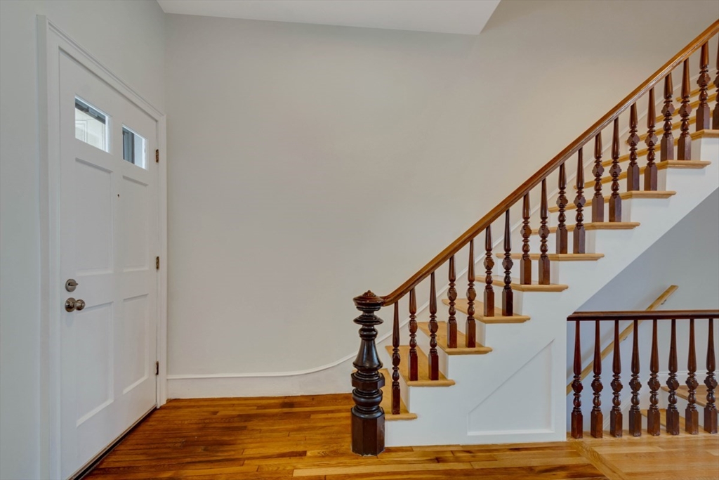 a view of entryway with wooden floor
