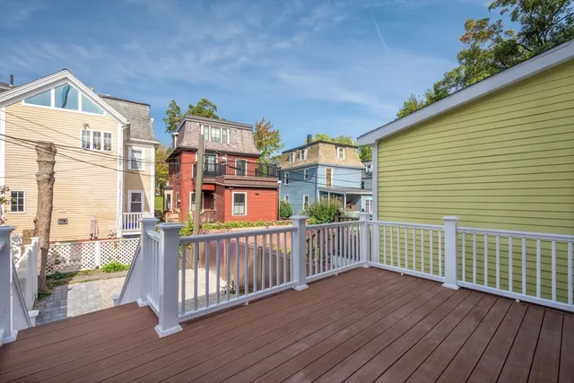 a view of a balcony with chair and potted plant