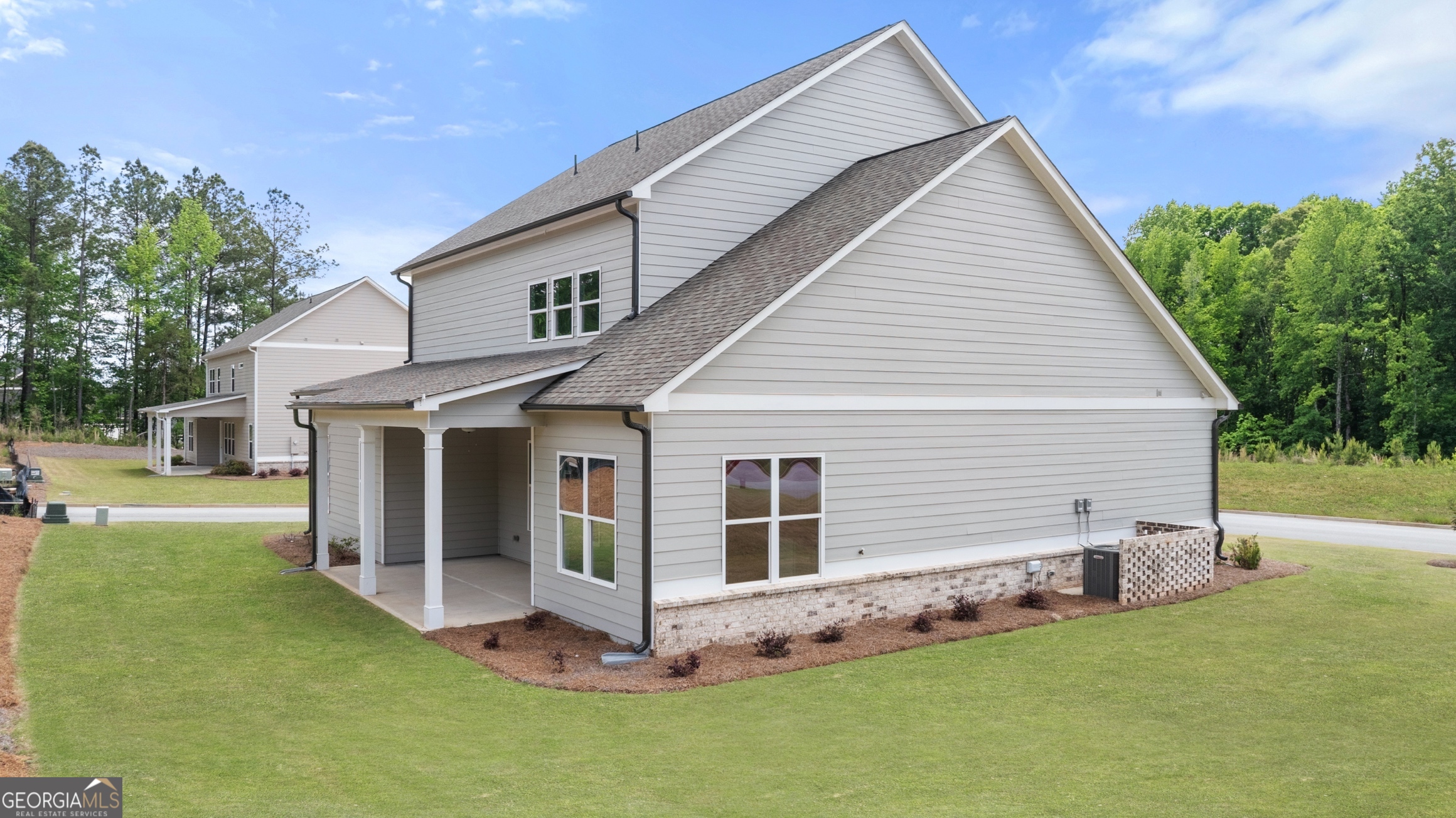 15 Overview Court Hoschton, GA 30548 - Photo 39 of 43 a view of a house with a yard