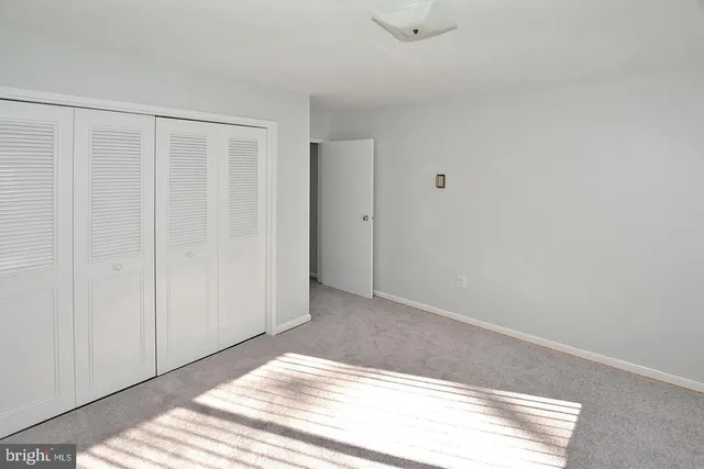 a view of a livingroom with wooden floor and closet