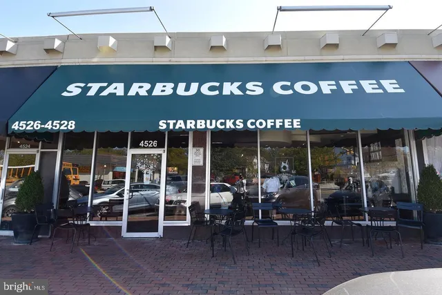 a view of a building with sitting area