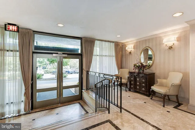a view of a livingroom with furniture and a window