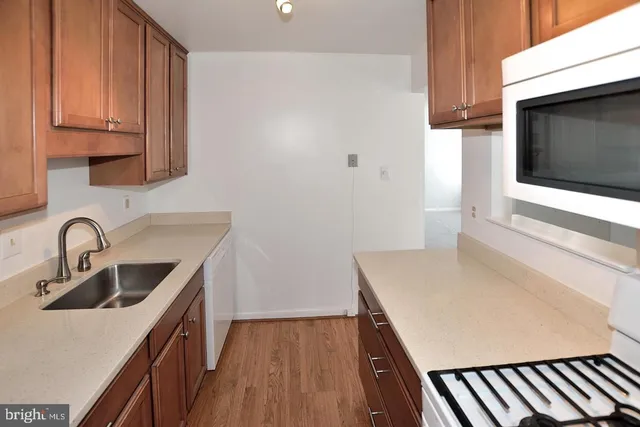 a kitchen with a sink and a microwave