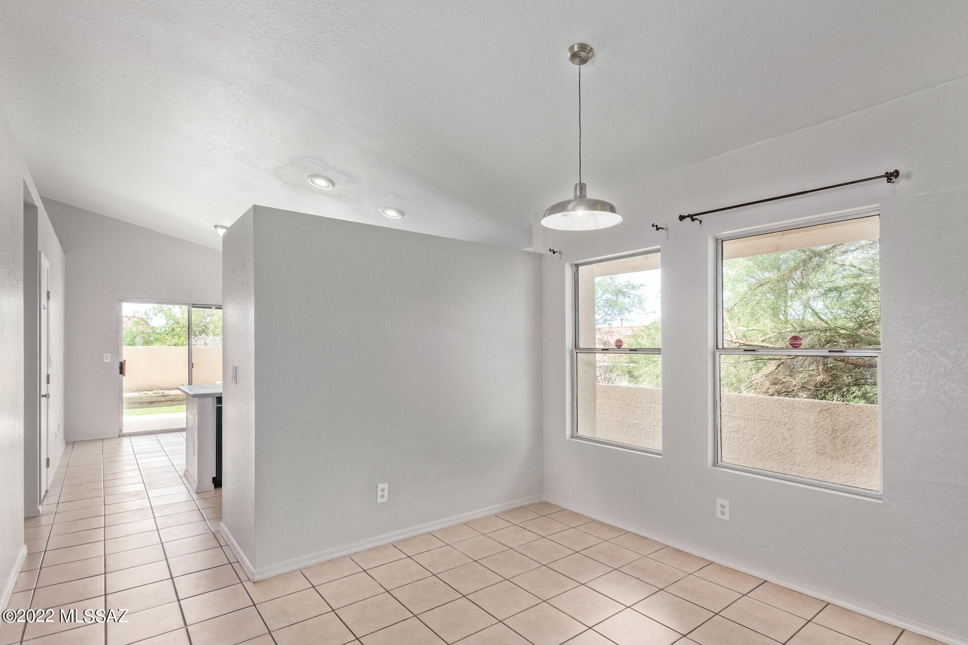 4697 West Weathervane Street Tucson, AZ 85741 - Photo 8 of 25 a view of a room with window and chandelier fan