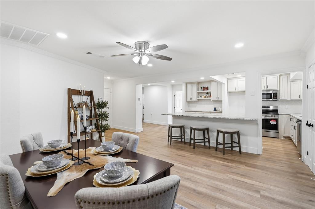 9938 John Flowers Road Wills Point, TX 75169 - Photo 22 of 40 Dining room with recessed lighting, ornamental molding, light wood-style flooring, and a ceiling fan