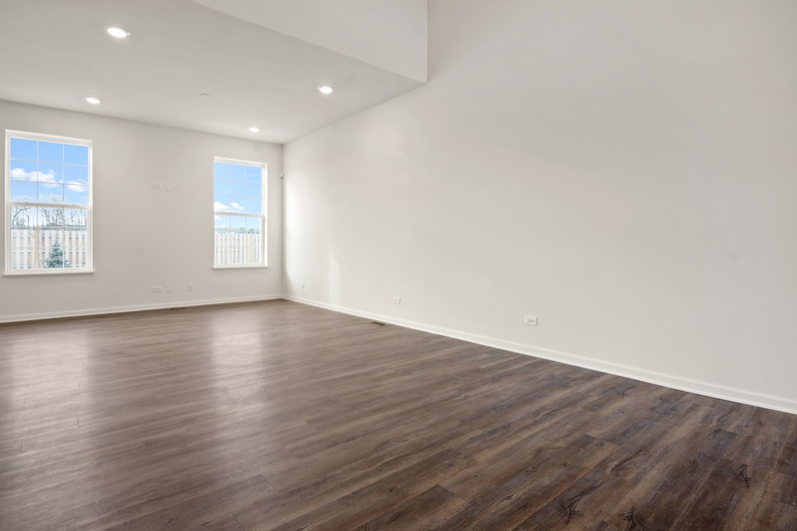 2057 Stuttle Road Batavia, IL 60510 - Photo 5 of 20 an empty room with wooden floor and windows