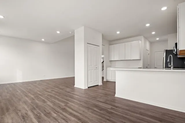 a view of kitchen with wooden floor