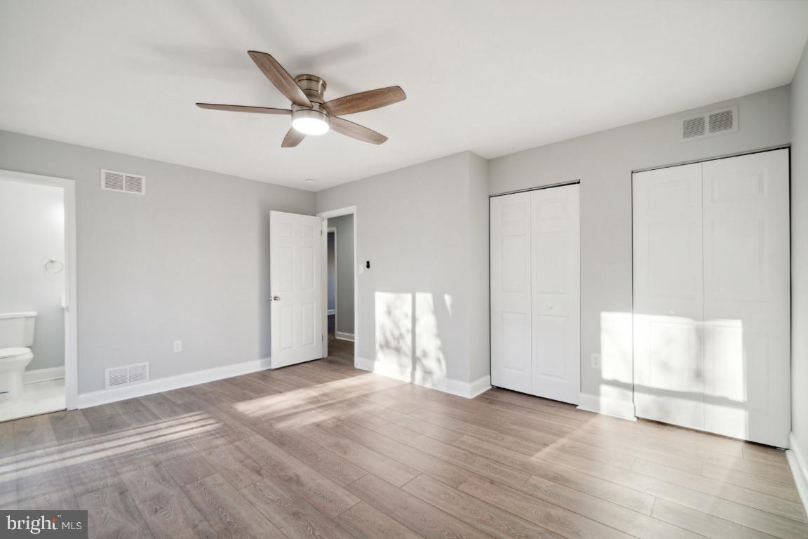 517 Holly Road Fort Washington, MD 20744 - Photo 21 of 40 a view of empty room with wooden floor and fan