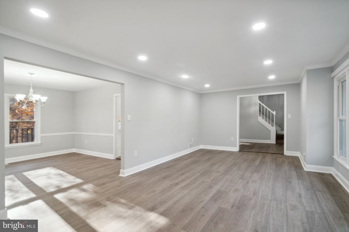 517 Holly Road Fort Washington, MD 20744 - Photo 4 of 40 an empty room with wooden floor and windows