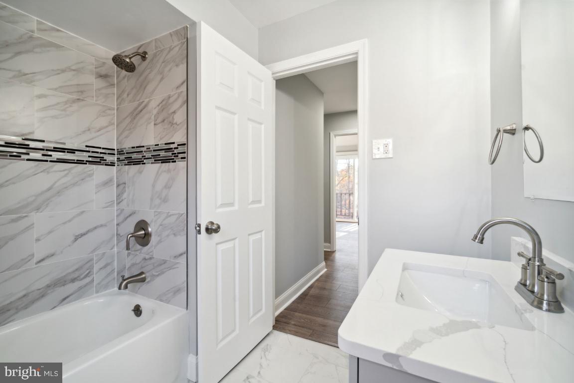 517 Holly Road Fort Washington, MD 20744 - Photo 6 of 40 a bathroom with a sink and a shower
