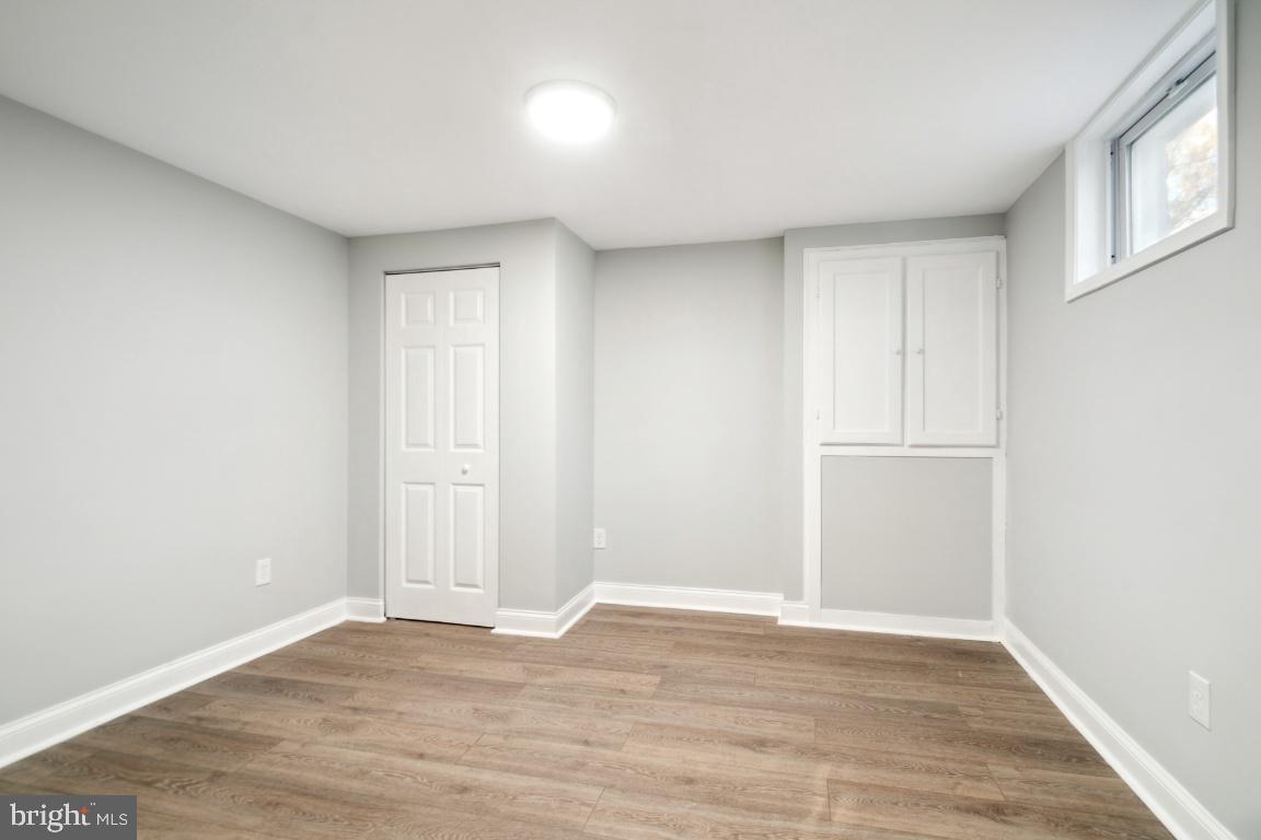 517 Holly Road Fort Washington, MD 20744 - Photo 8 of 40 a view of an empty room with wooden floor