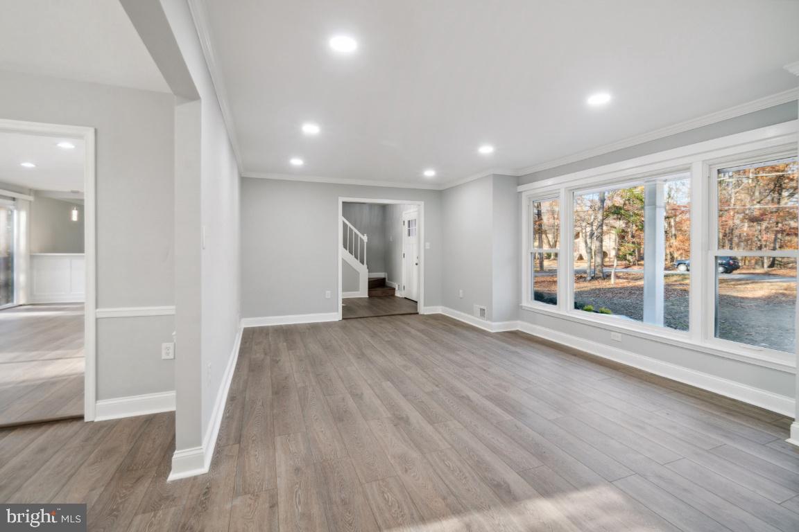 517 Holly Road Fort Washington, MD 20744 - Photo 10 of 40 wooden floor in an empty room with a window