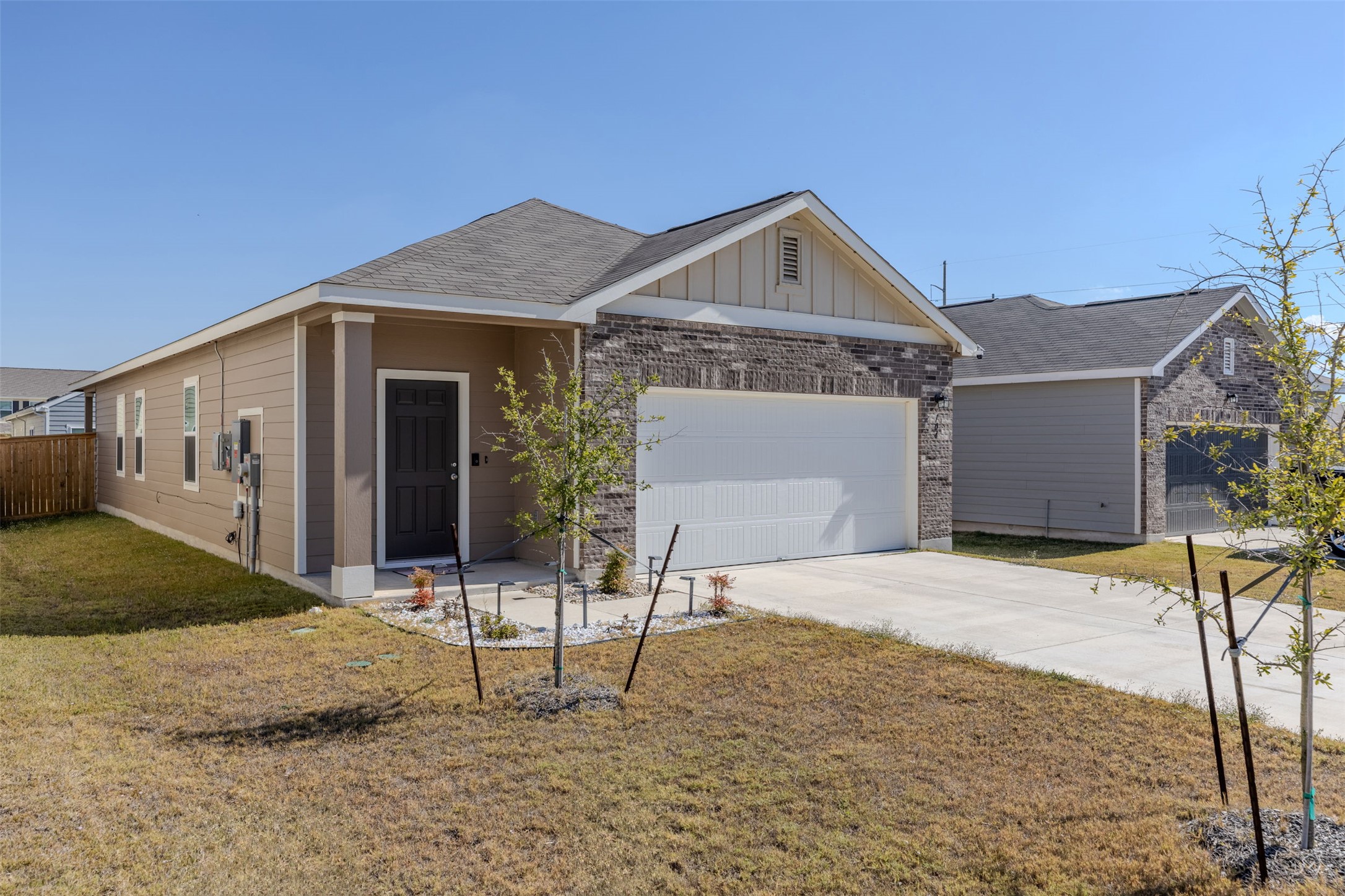 104 Enforcer Loop Jarrell, TX 76537 - Photo 2 of 12 a front view of a house with a yard