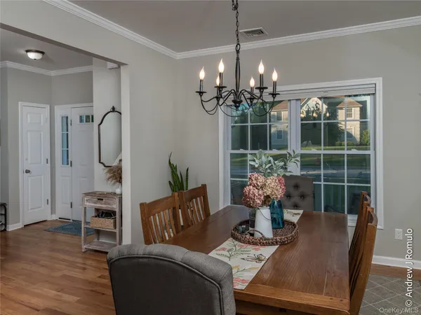 a living room with furniture chandelier and a chandelier
