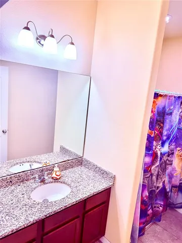 a bathroom with a sink and a bath tub