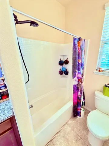 a bedroom with a bed and dresser