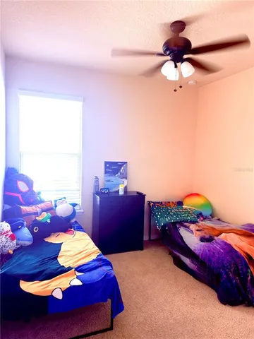 a view of a hallway and a livingroom with a furniture