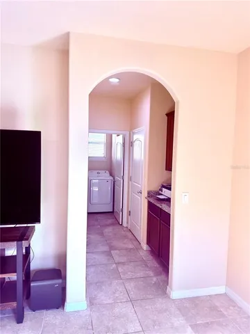 a kitchen with a stove top oven and cabinets