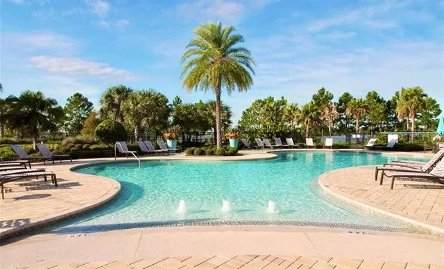 an aerial view of a house with a garden and yard