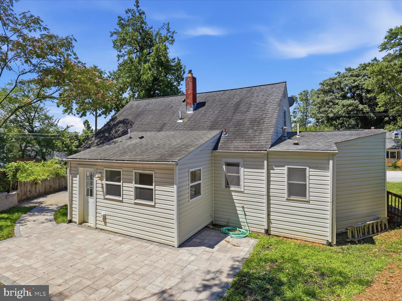 6003 Rixey Drive Alexandria, VA 22303 - Photo 36 of 37 Rear view of the home with inviting patio space.