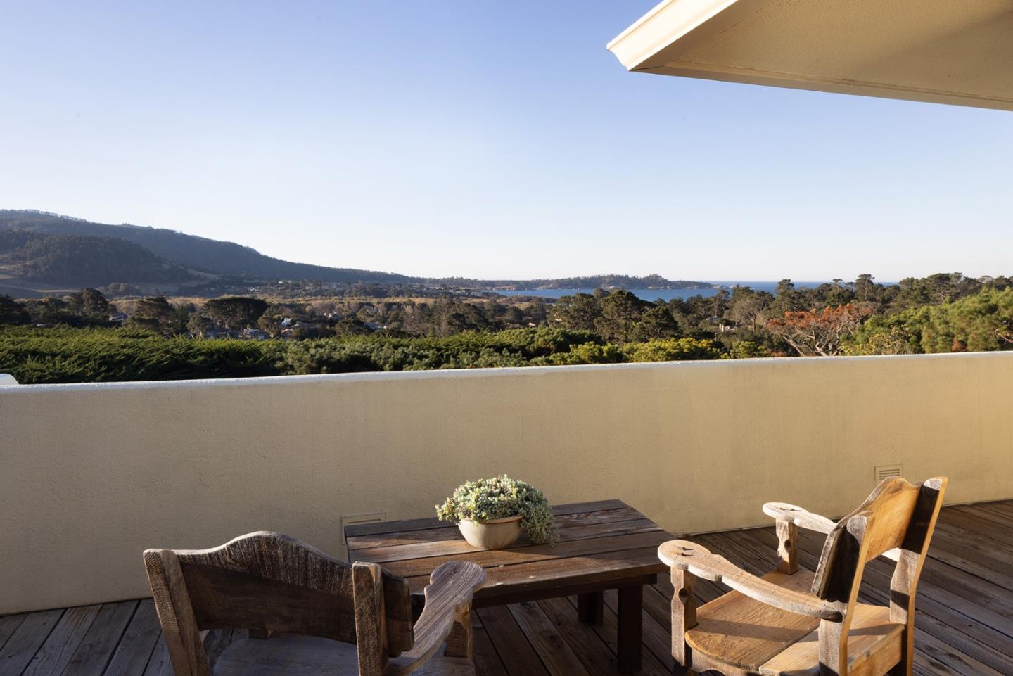 25820 Hatton Road Carmel, CA 93923 - Photo 15 of 36 a view of a lake with a table and chairs