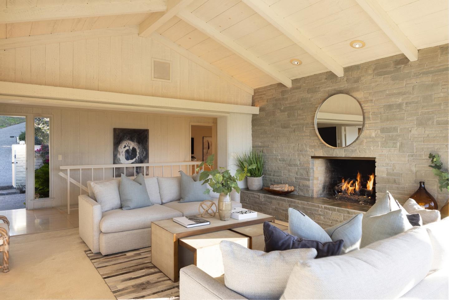 25820 Hatton Road Carmel, CA 93923 - Photo 7 of 36 a living room with furniture a fireplace and a potted plant