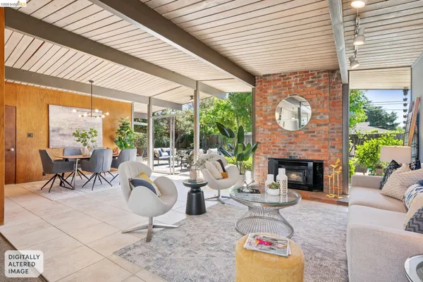 a open kitchen with stainless steel appliances granite countertop a stove a sink dishwasher and white cabinets with wooden floor