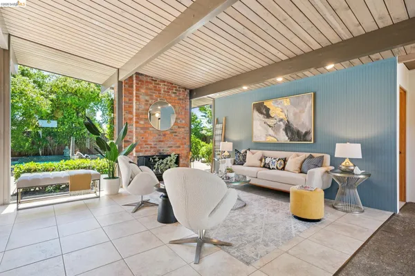 a view of an outdoor dining space with a table and chairs