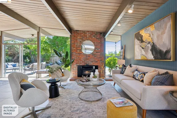 a dining room with furniture a rug and wooden floor