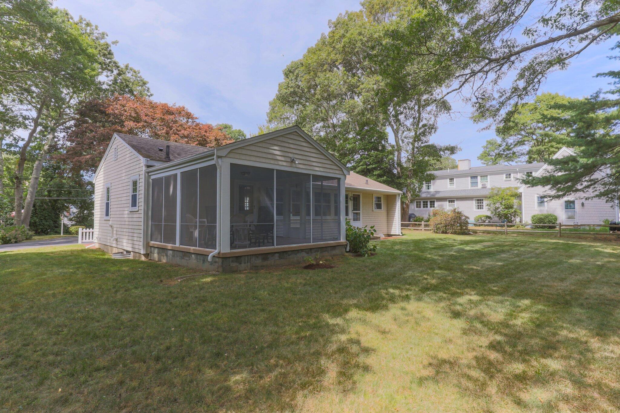 87 Conners Road Centerville, MA 02632 - Photo 45 of 54 a view of a house with a yard
