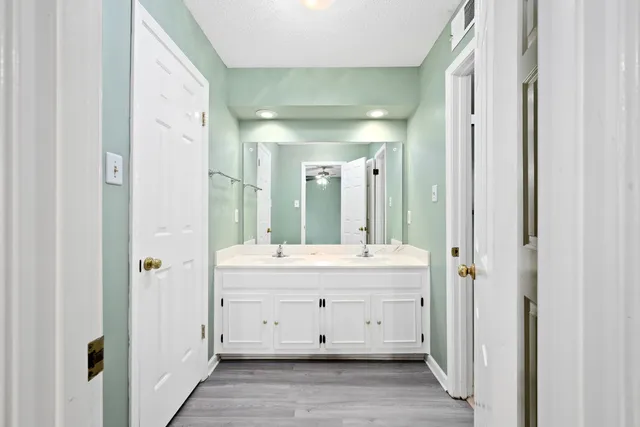 a bathroom with a double vanity sink mirror and double