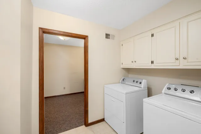 a view of storage and utility room with washer and dryer