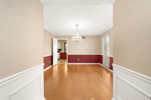 a view of a livingroom with a chandelier fan