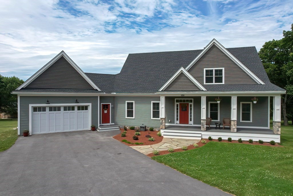 128 Nourse Road Bolton, MA 01740 - Photo 1 of 42 front view of a house with a yard
