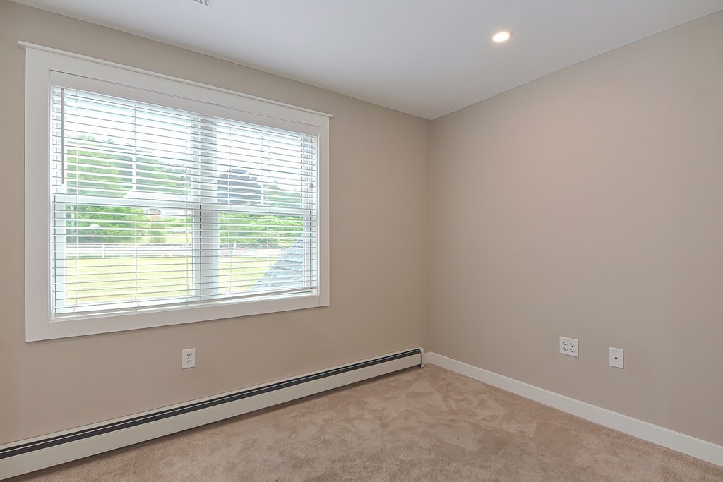 128 Nourse Road Bolton, MA 01740 - Photo 23 of 42 a view of an empty room with a window
