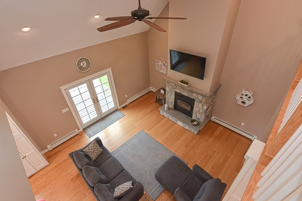 128 Nourse Road Bolton, MA 01740 - Photo 31 of 42 a living room with furniture and a flat screen tv