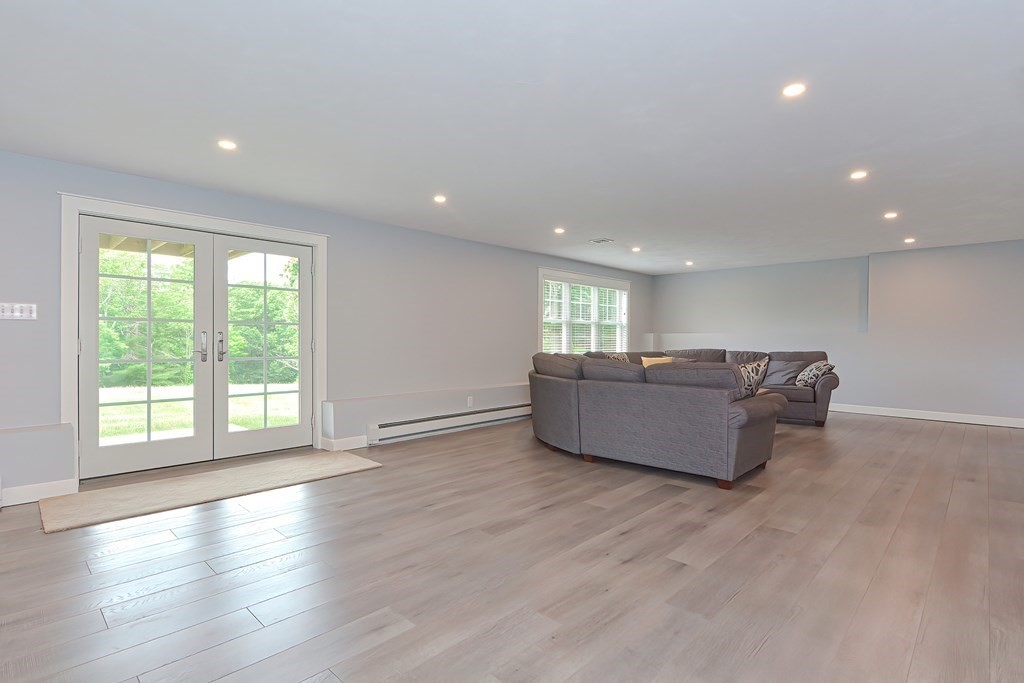 128 Nourse Road Bolton, MA 01740 - Photo 33 of 42 a living room with furniture and a large window