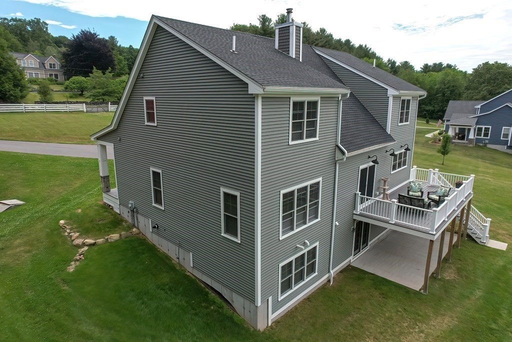 128 Nourse Road Bolton, MA 01740 - Photo 38 of 42 a view of a house with backyard