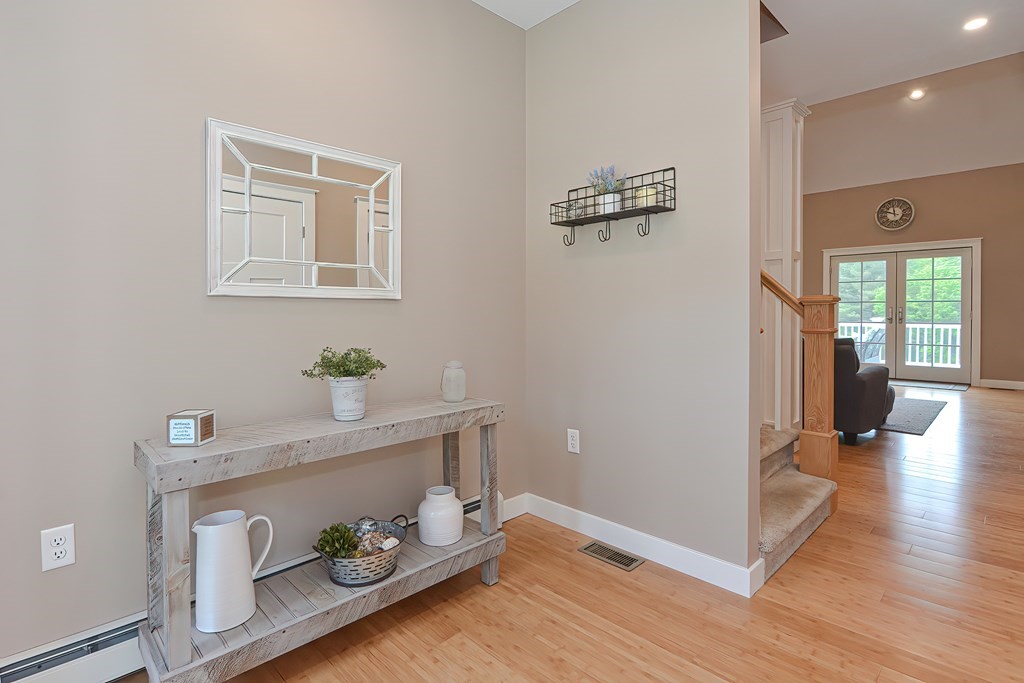 128 Nourse Road Bolton, MA 01740 - Photo 4 of 42 a view of entryway with wooden floor