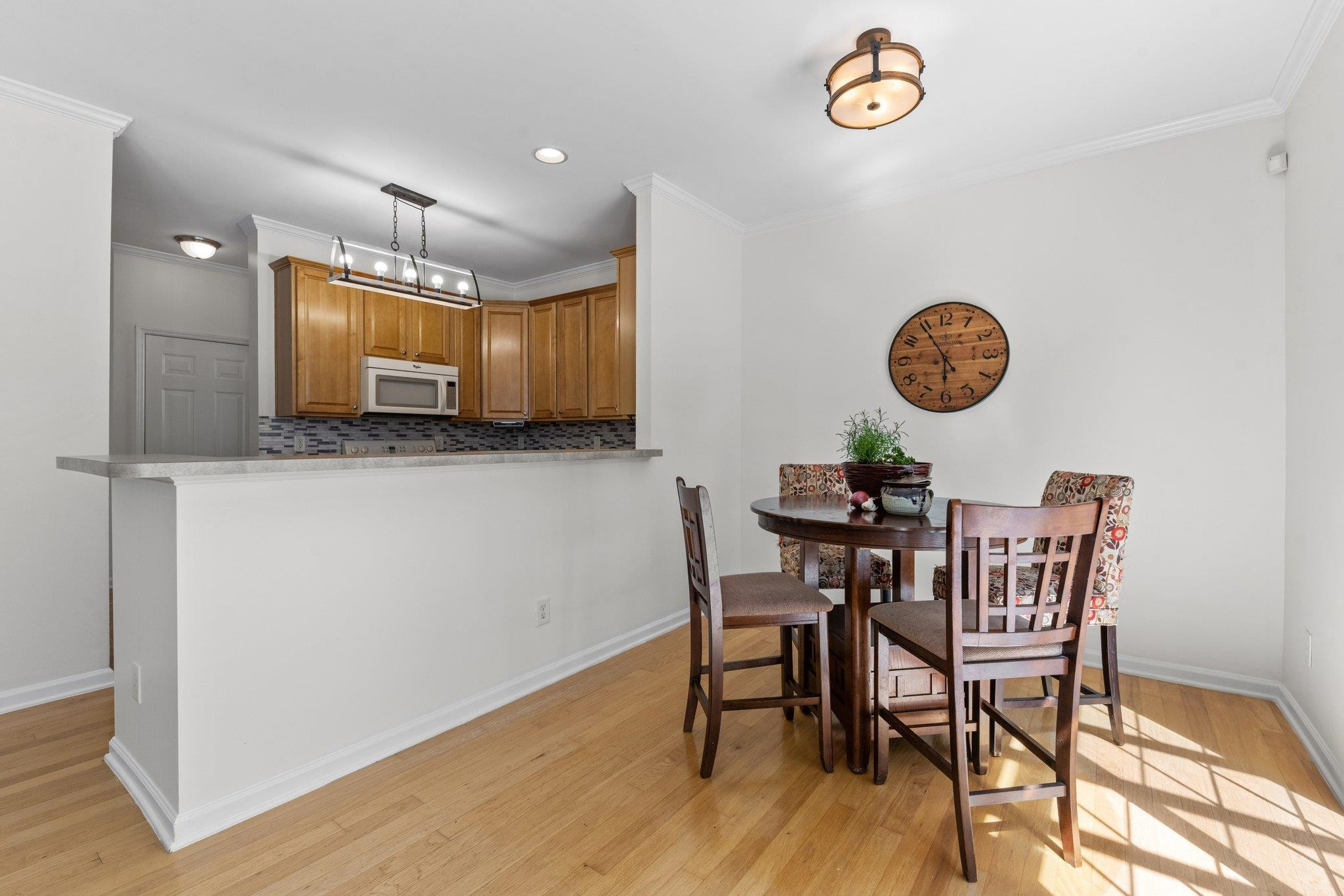 8411 Tie Stone Way Raleigh, NC 27613 - Photo 15 of 38 a view of a kitchen with table and chairs