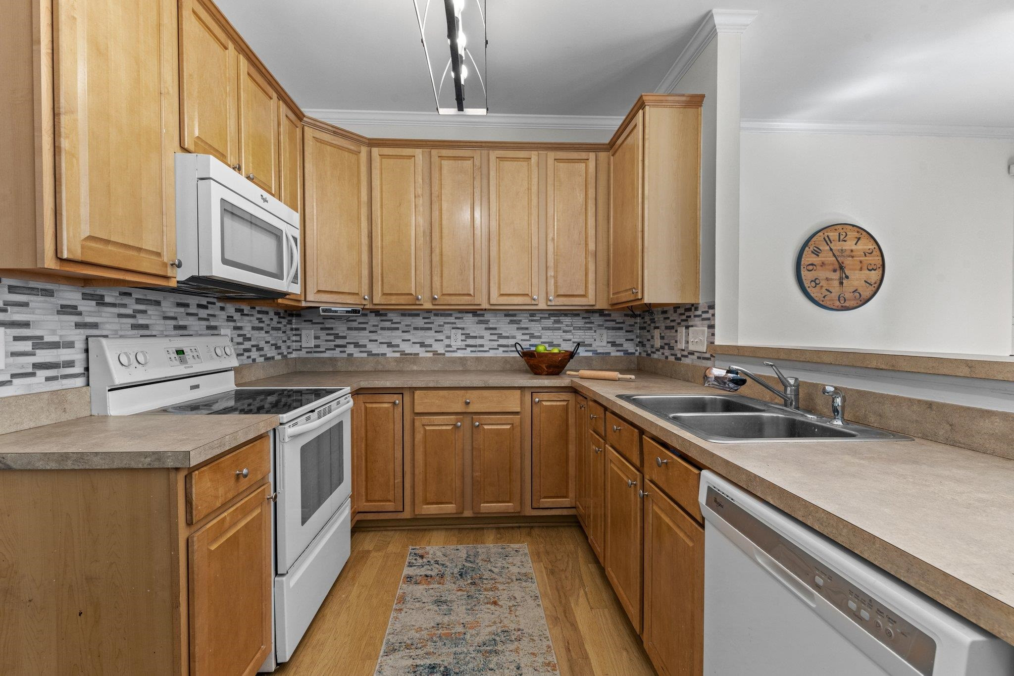 8411 Tie Stone Way Raleigh, NC 27613 - Photo 17 of 38 a kitchen with a sink stove top oven and cabinets