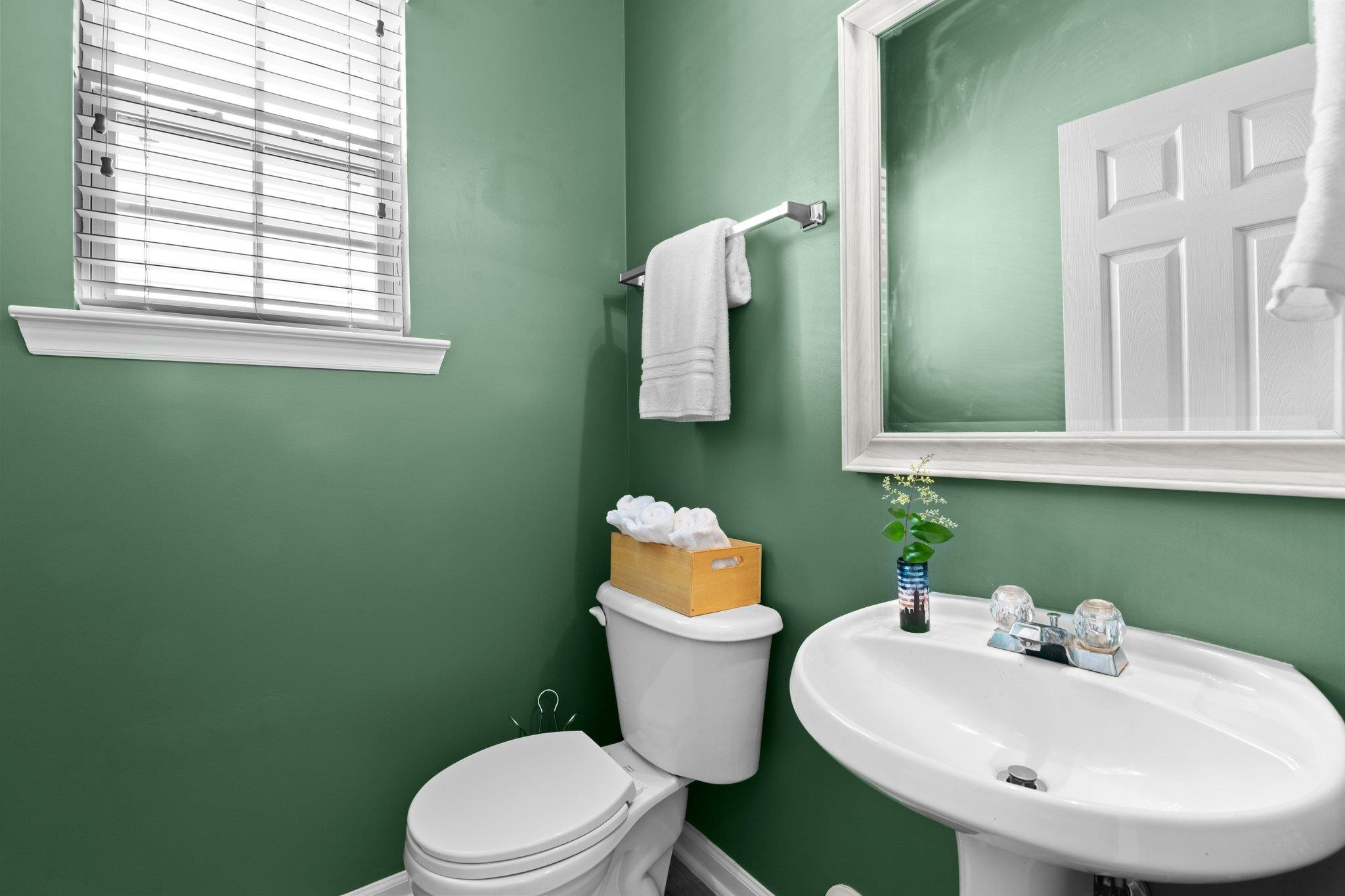 8411 Tie Stone Way Raleigh, NC 27613 - Photo 18 of 38 a bathroom with a sink toilet and mirror