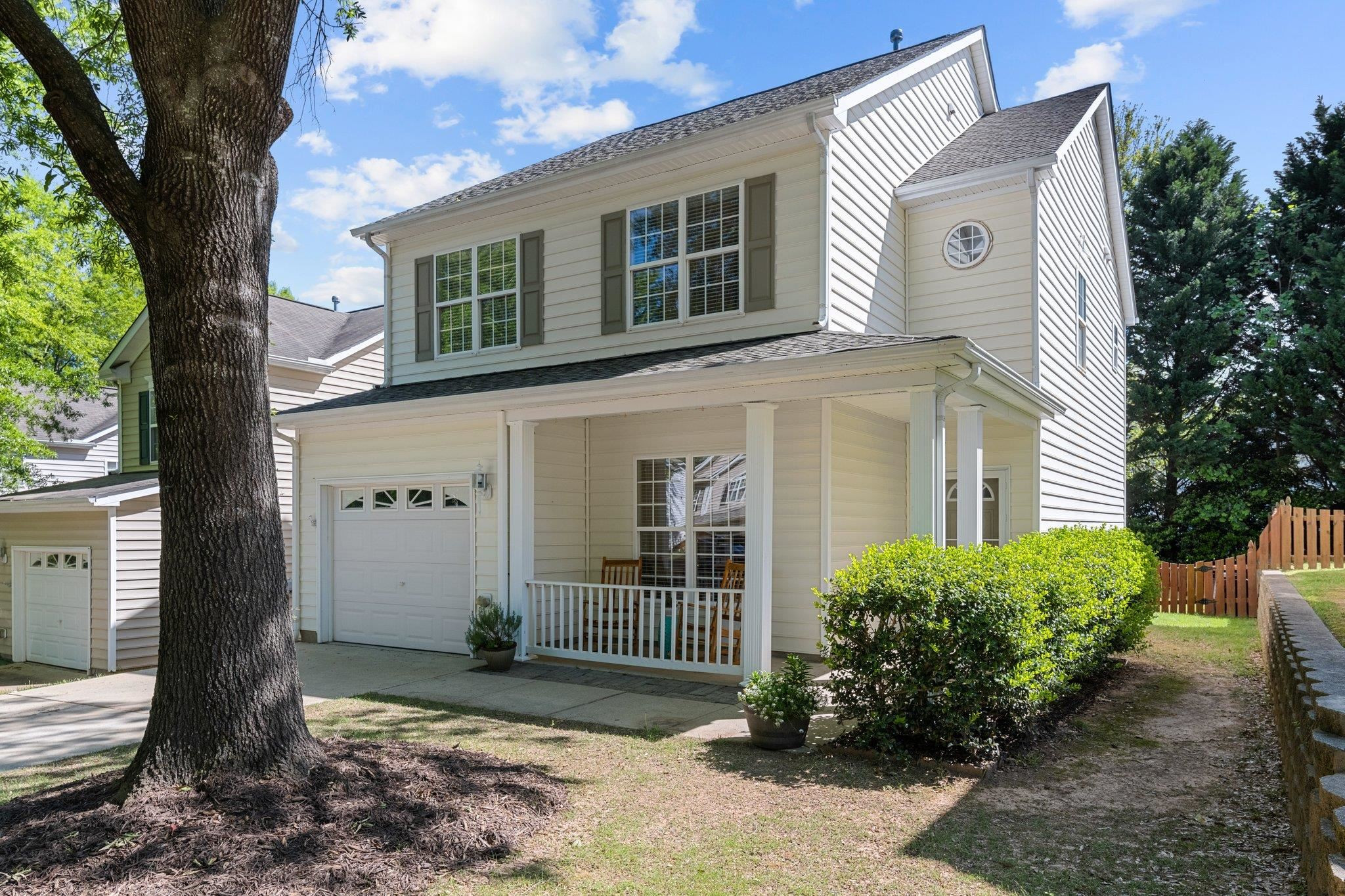 8411 Tie Stone Way Raleigh, NC 27613 - Photo 2 of 38 a front view of a house with garden