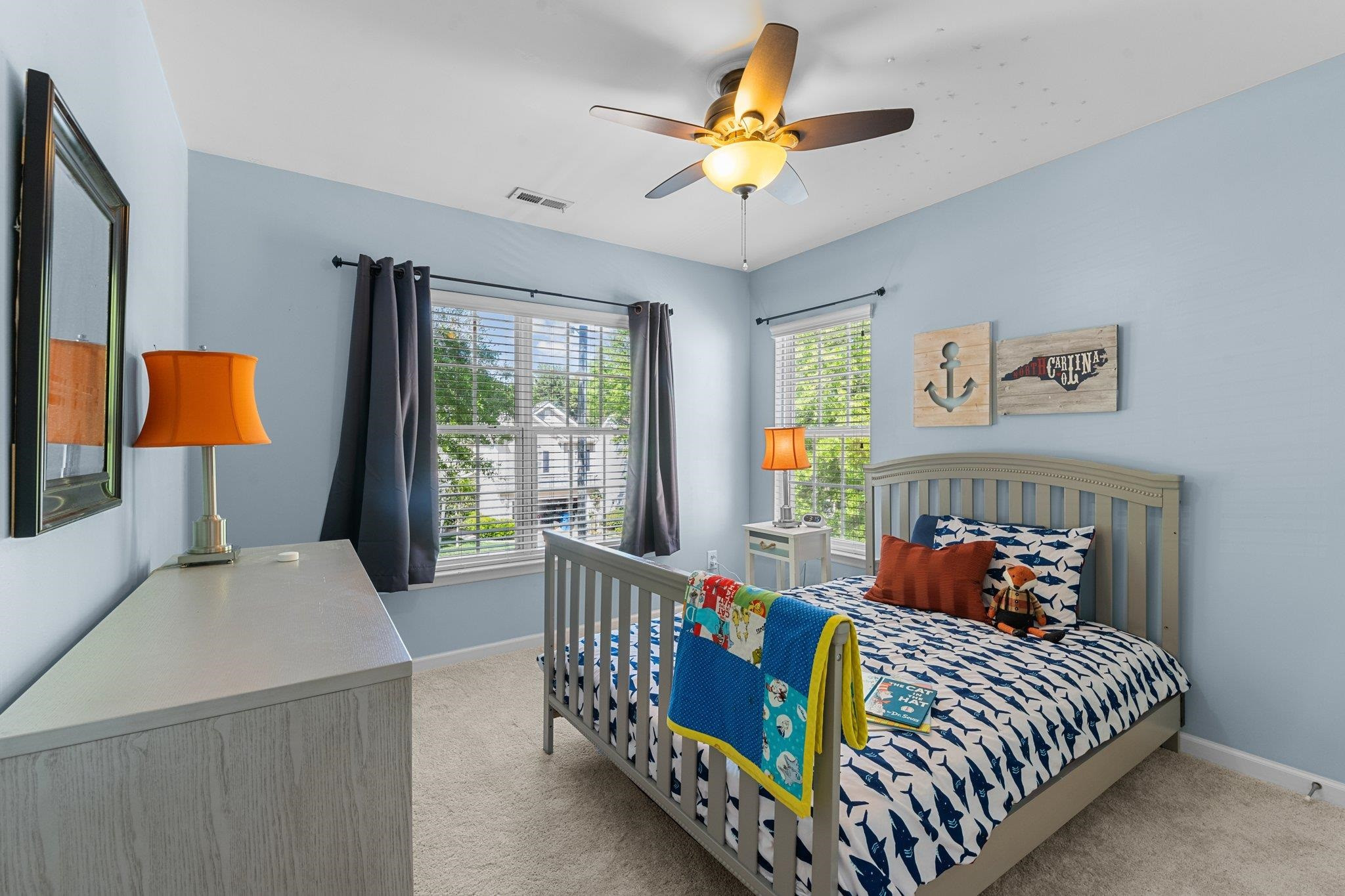 8411 Tie Stone Way Raleigh, NC 27613 - Photo 25 of 38 a bedroom with a bed and a table in it